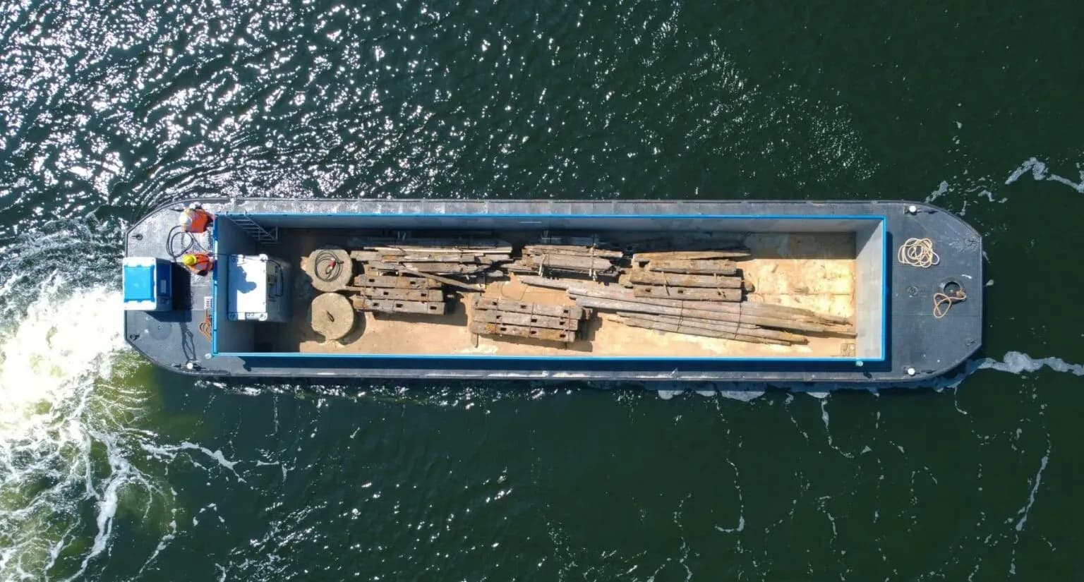 Top-down aerial of the Zoev City electric cargo barge on the water.